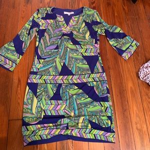 Trina Turk mini dress worn once.  Fully lined and super mod. Rayon blend with st